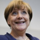 German Chancellor Angela Merkel smiles as she arrives for a special meeting of the Christian Democratic Union (CDU) party faction on the eve of a special session of the parliament Bundestag about negotiations with Greece for a new bailout in Berlin, Germany, Thursday, July 16, 2015. (AP Photo/Markus Schreiber)