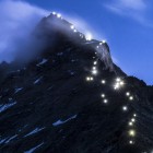 Lamps illuminate the path of the first ascent on the Matterhorn mountain, seen from the Hoernli mountain hut, in Zermatt, Switzerland, Late Monday, July 13, 2015. Authorities in Switzerland have declared the iconic Matterhorn mountain off-limits for a day on Tuesday, July 14, 2015, on the 150th anniversary of the first ascent. The so-called Matterhorn silence is intended to honor more than 500 climbers who have died trying to reach the top. (Dominic Steinmann/Keystone via AP)